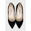 Black pony skin pumps