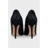 Black pony skin pumps