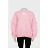 Pink sweatshirt with brand logo