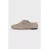 Suede shoes with embossed logo