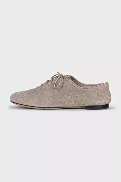 Suede shoes with embossed logo