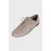 Suede shoes with embossed logo