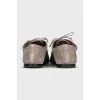 Suede shoes with embossed logo