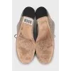 Suede shoes with embossed logo