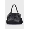 Leather bag with signature clochette