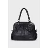 Leather bag with signature clochette