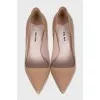 Beige patent leather pumps