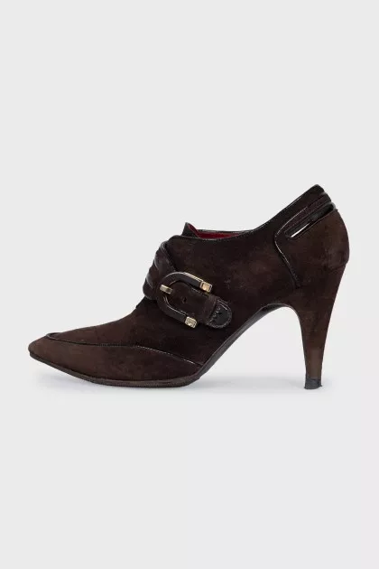 Suede ankle boots with a gold buckle