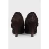 Suede ankle boots with a gold buckle