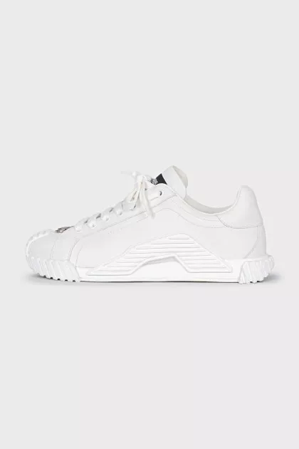 White sneakers with a silver logo