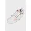 White sneakers with zippers