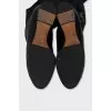 Black boots with embossed toe cap