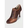 Brown ankle boots with perforated leather