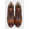 Brown ankle boots with perforated leather