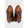 Brown ankle boots with perforated leather