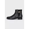 Leather boots with signature decor