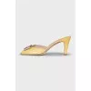 Yellow mules with silver decor