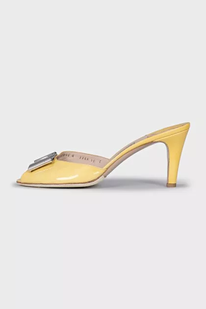 Yellow mules with silver decor