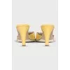 Yellow mules with silver decor