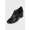 Patent leather shoes with stacked heels