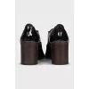Patent leather shoes with stacked heels