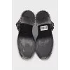 Black boots with metallic decor
