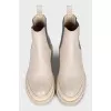White leather boots with elastic bands