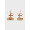 Golden earrings of a figured shape