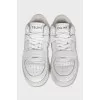 White sneakers with perforations