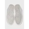 White sneakers with perforations