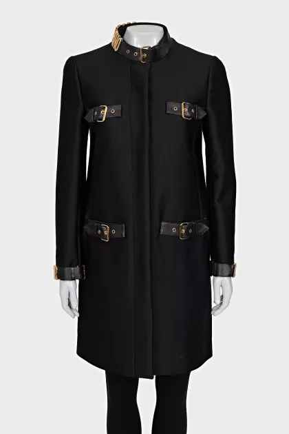 The black coat is decorated with a golden logo.