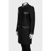 The black coat is decorated with a golden logo.