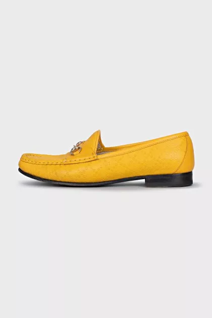 Yellow loafers with gold decor