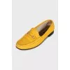Yellow loafers with gold decor