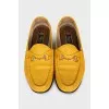 Yellow loafers with gold decor