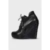 Black ankle boots with perforated leather