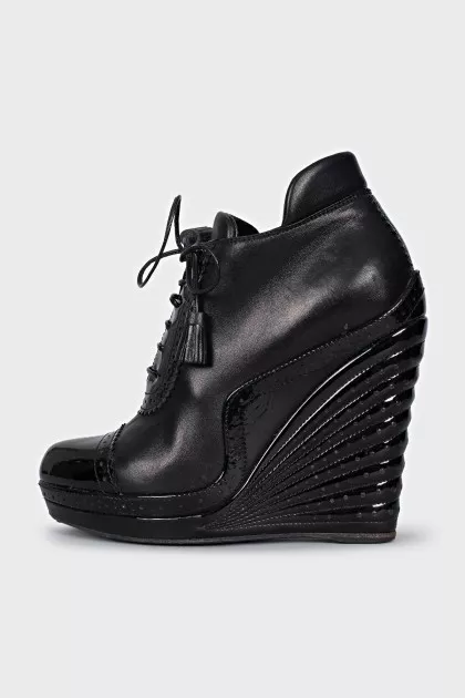 Black ankle boots with perforated leather
