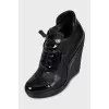 Black ankle boots with perforated leather