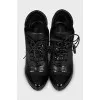 Black ankle boots with perforated leather