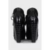Black ankle boots with perforated leather