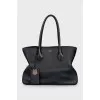 Black tote with signature clochette