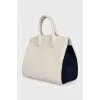 Leather bag with suede inserts