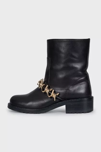 Leather boots with gold-tone decor on the front