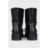 Leather boots with gold-tone decor on the front