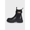 Leather boots with a gold buckle