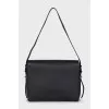 Leather shoulder bag with tag