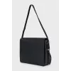 Leather shoulder bag with tag