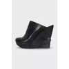 Leather shoes with a textured wedge heel