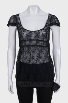 Lace blouse with a bow at the bottom
