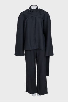 Black suit with trousers, top and cape